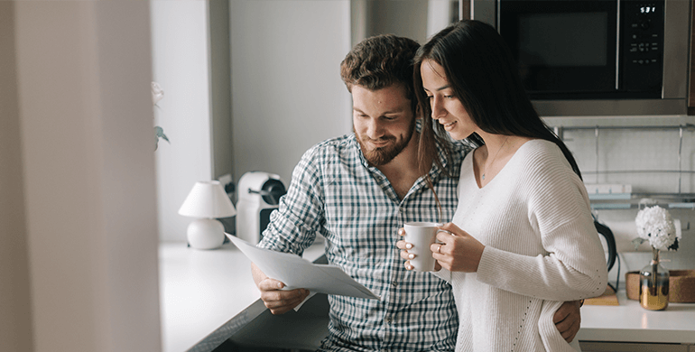 couple reading contract documents