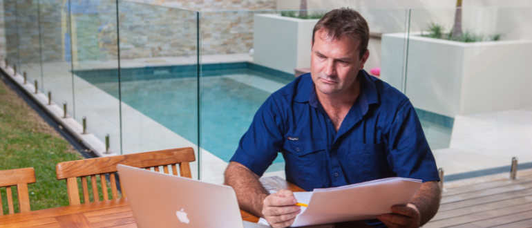 tradesperson man laptop pool